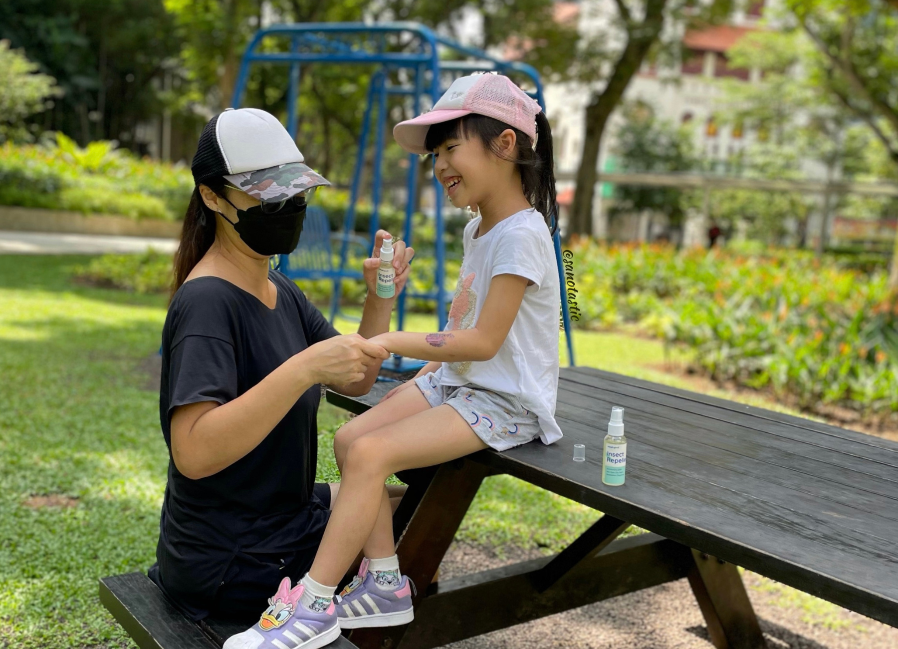 Sandra applying SimplyGood's insect repellent on her daughter's arm